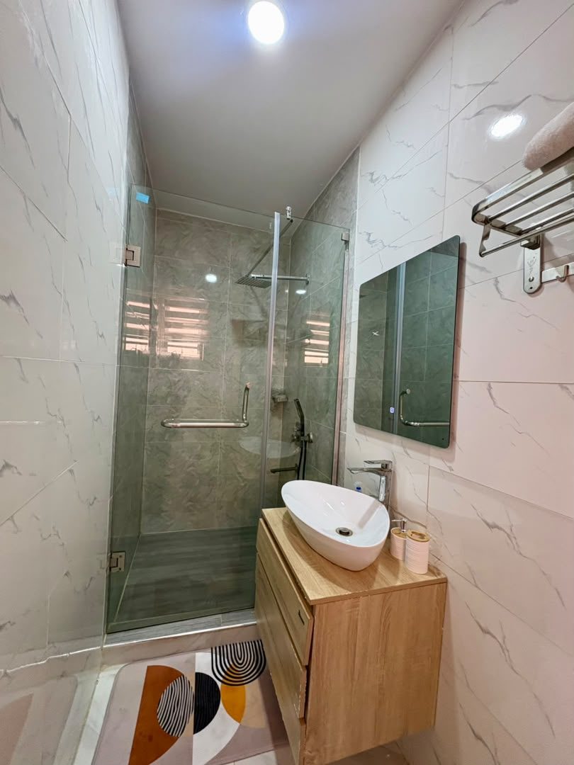 Leona bathroom with glass shower enclosure